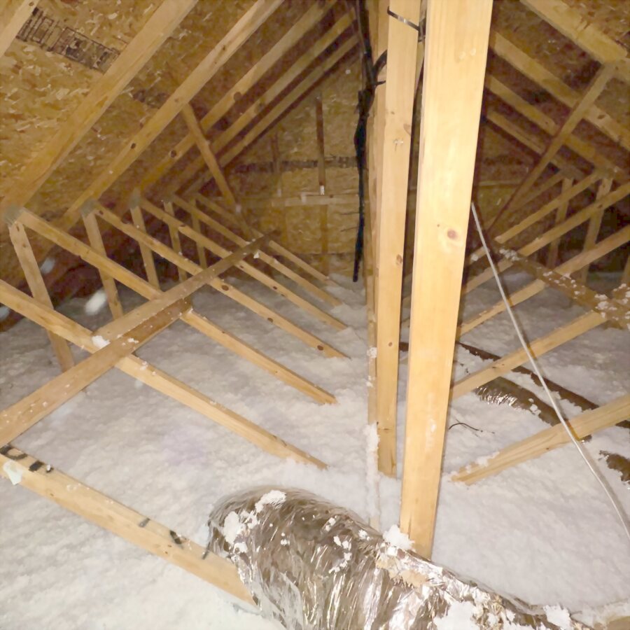 Attic framing and ducts after clearing.